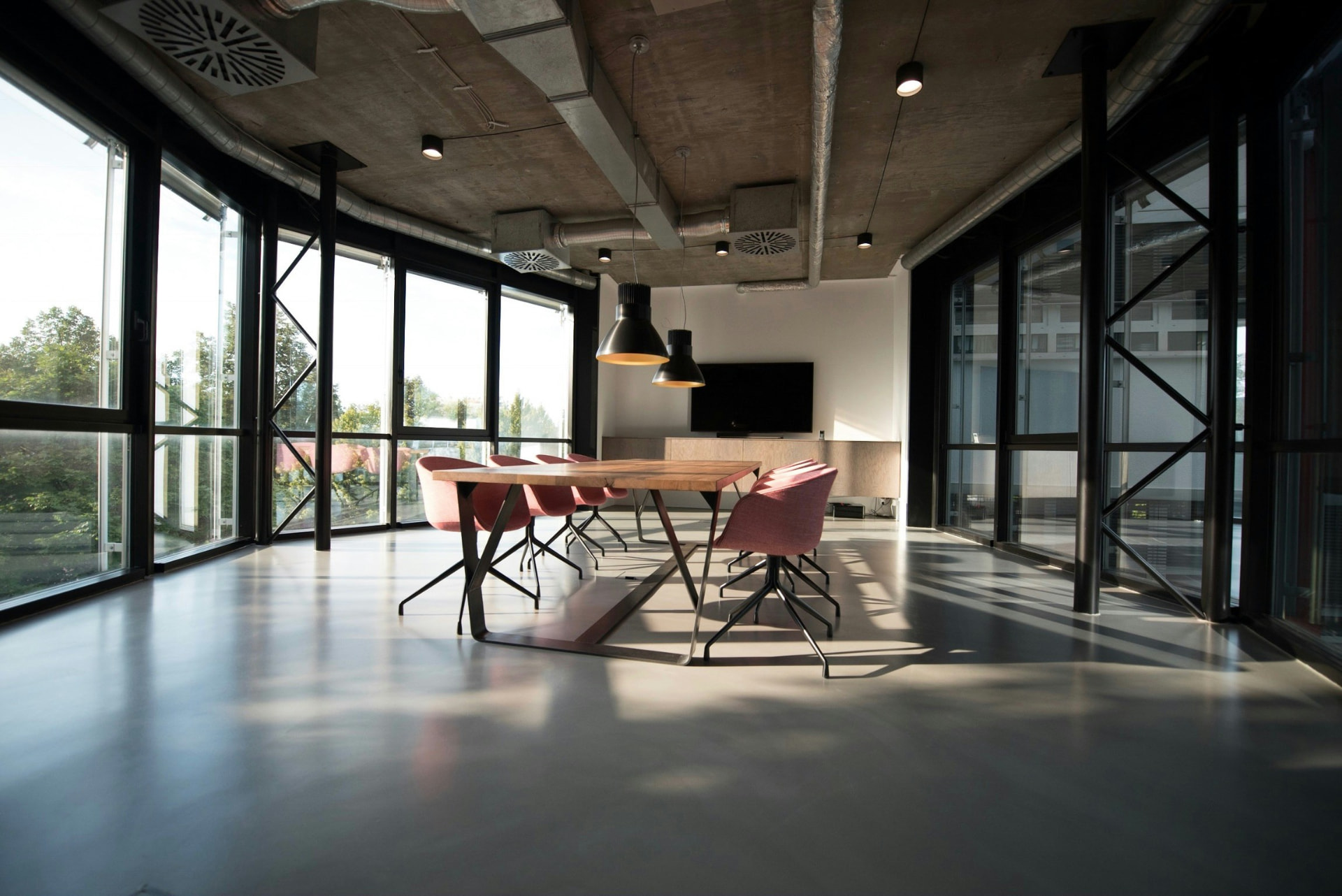 Bright modern meeting room with a large table and city view