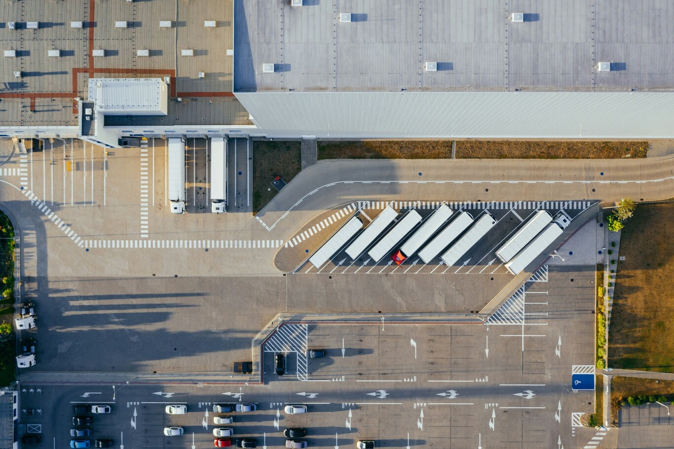 Aerial view of a distribution centre with trucks at loading docks