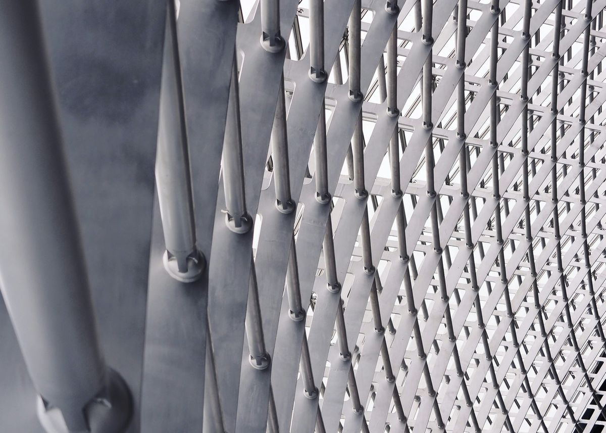 Stacked steel coils and metal sheets inside a bonded warehouse