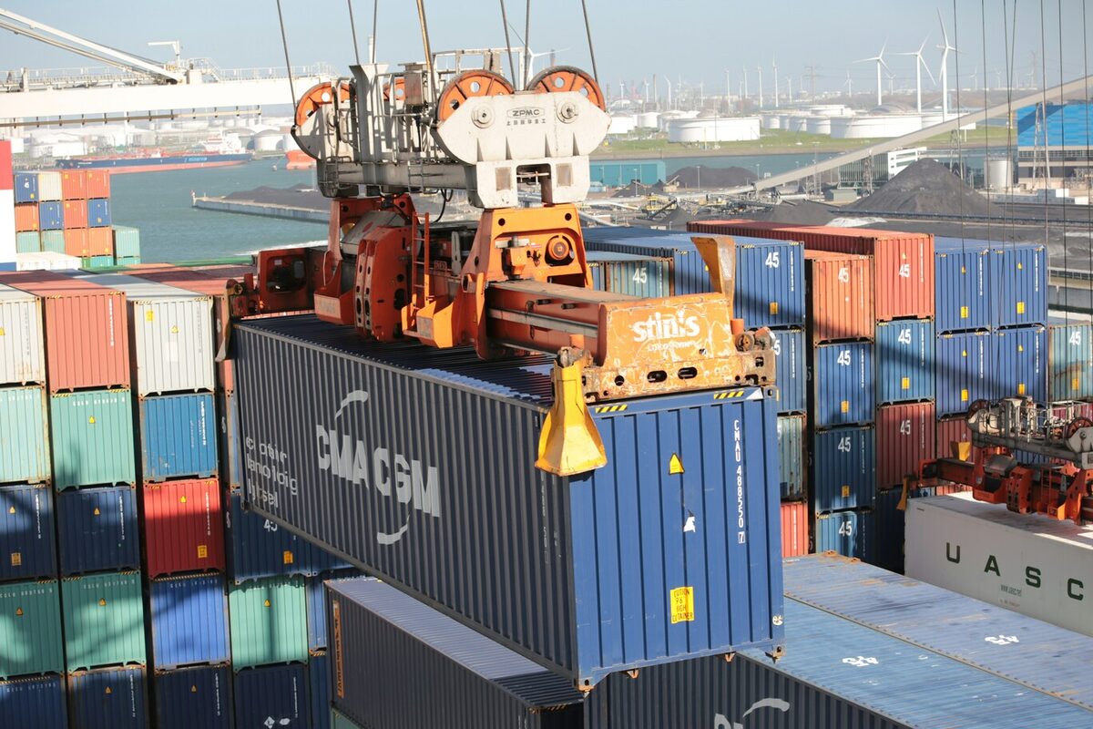 Container port with cranes loading a ship