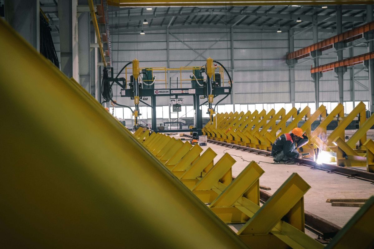 Logistics operations with forklifts moving pallets inside a warehouse