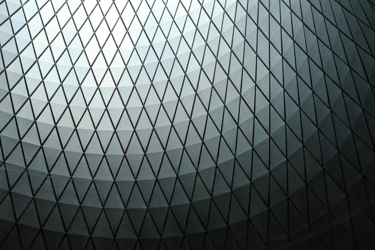 Aerial view of container port with cargo ships and stacked containers